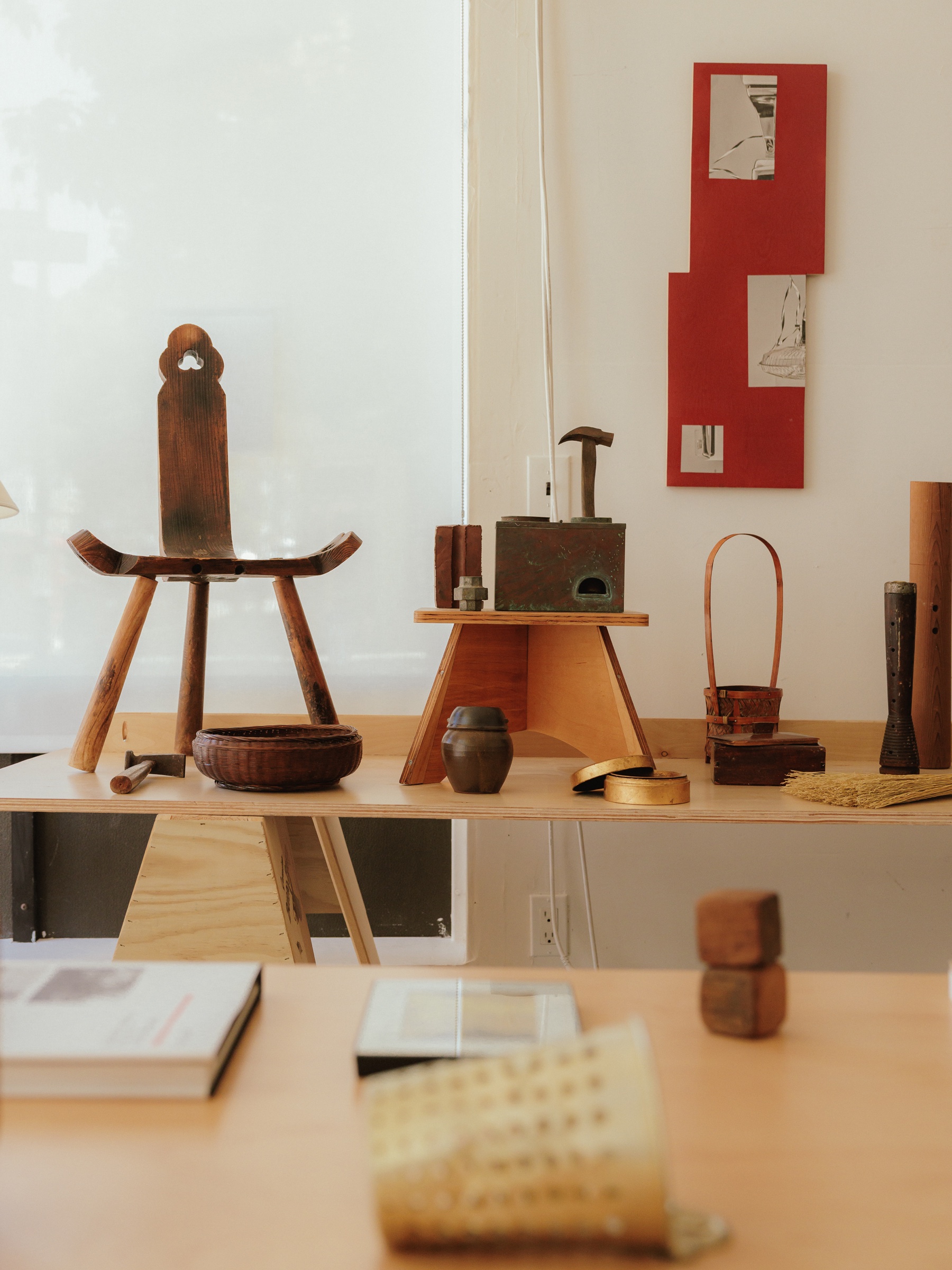 A collection of sculptural objects arranged throughout a studio